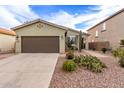 Attractive one-story house featuring desert landscaping and a two-car garage at 42577 W Rosalia Dr, Maricopa, AZ 85138