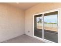 Covered patio with sliding glass doors, seamlessly blending indoor and outdoor living spaces for relaxation at 4821 S 12Th St, Phoenix, AZ 85040