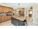 Traditional kitchen with island, granite countertops, stainless steel appliances, and custom cabinetry at 6420 E Gary Rd, Scottsdale, AZ 85254