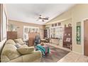 Inviting living room with neutral tones, plantation shutters, and comfortable seating arrangement at 674 S 231St Dr, Buckeye, AZ 85326