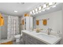 Clean bathroom featuring a double sink vanity, shower, and neutral color scheme at 6834 E 4Th St # 6, Scottsdale, AZ 85251