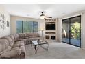 Inviting living room with sliding glass doors and lots of natural light at 705 W Queen Creek Rd # 2006, Chandler, AZ 85248