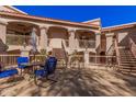 Condo courtyard featuring multiple floors and exterior staircases with a sitting area at 9151 W Greenway Rd # 277, Peoria, AZ 85381