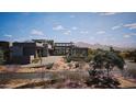 Contemporary home with desert landscaping and mountain views at 9290 E Thompson Peak Pkwy # 401, Scottsdale, AZ 85255