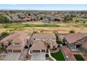 Gorgeous home overlooking a golf course with lush greenery and beautiful community at 9765 E Lompoc Ave, Mesa, AZ 85209