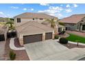 Beautiful two-story home boasting a three-car garage and meticulously maintained landscaping at 9765 E Lompoc Ave, Mesa, AZ 85209