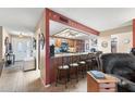 Open-concept kitchen featuring a breakfast bar, modern appliances, and stylish countertops at 1056 S 79Th St, Mesa, AZ 85208