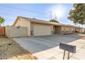 A tidy single-Gathering home featuring a two-car garage and a well-maintained yard at 1549 W Peralta Ave, Mesa, AZ 85202