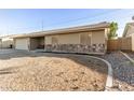 Street view of a single-story home featuring a two-car garage and low-maintenance landscaping at 1549 W Peralta Ave, Mesa, AZ 85202