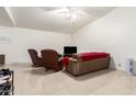 Bright living room with tile floors, modern furniture, and a ceiling fan at 1549 W Peralta Ave, Mesa, AZ 85202