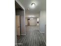 Open hallway showcasing wood-look tile flooring and views into the home's interior at 1743 W Pollack St, Phoenix, AZ 85041