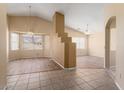 Spacious living room boasting vaulted ceilings and stylish flooring at 17813 W Primrose Ln, Surprise, AZ 85374