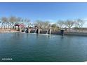 Scenic pond in the community featuring water features and a picnic pavilion at 18803 N Avelino Dr, Maricopa, AZ 85138