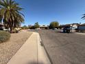 A view of the street, showing a quiet residential neighborhood at 1954 W Kerry Ln, Phoenix, AZ 85027