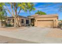 Charming single-story home with mature landscaping and a two-car garage at 2029 N 109Th Ave, Avondale, AZ 85392