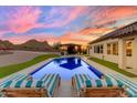 Relaxing pool with sun loungers and a modern cabana, perfect for enjoying the sunset views at 297 W Chase St, San Tan Valley, AZ 85143