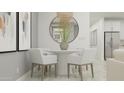 Bright dining room with a round table, white chairs, and stylish decorative mirror and plant at 3205 E Outlaw Ln, San Tan Valley, AZ 85140