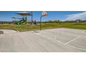 Community basketball court and playground offer recreational options for residents at 3382 E Saddletree Way, San Tan Valley, AZ 85140