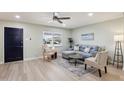 Cozy living room showcasing a gray sectional sofa, stylish decor, and comfortable seating at 4235 N 16Th Dr, Phoenix, AZ 85015