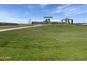 Lush green community park featuring a covered playground at 4513 W 95Th Dr, Tolleson, AZ 85353