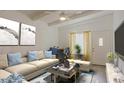 Cozy living room featuring neutral tones, ceiling fan, and stylish furnishings at 4754 N 14Th St, Phoenix, AZ 85014