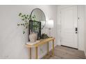 Bright entryway with a modern console table, decor and sleek flooring at 5460 S Dillon Cir, Mesa, AZ 85212