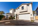 Charming two-story home featuring an attached two-car garage and well-maintained landscaping at 5460 S Dillon Cir, Mesa, AZ 85212