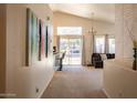 Bright and airy living room featuring a vaulted ceiling, a view of the pool and stylish decor at 723 W Canary Way, Chandler, AZ 85286