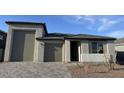 Charming single-story home with a two-car garage and neutral stucco exterior at 7654 W Tether Trl, Peoria, AZ 85383