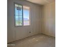 Bright bedroom with a large window offering scenic views ready for personalization at 9618 W Parkway Dr, Tolleson, AZ 85353