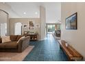 Bright entryway showcasing tile flooring, neutral walls, and an open floor plan at 104 W Windsong Dr, Phoenix, AZ 85045