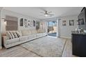 Bright living room with a large window and a comfortable sofa at 1200 E Penny Ln, San Tan Valley, AZ 85140