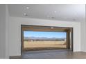 This great room features a large sliding glass door to the outdoor living area and mountain views at 12870 E Rosewood Dr, Scottsdale, AZ 85255