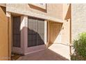 Private entryway featuring security door, stylish windows, and beautiful plants at 13820 S 41St Way, Phoenix, AZ 85044