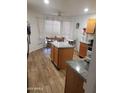 Bright eat-in kitchen with an island, wood floors, a breakfast table and lots of natural light at 13820 S 41St Way, Phoenix, AZ 85044