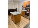 Well-lit kitchen with a dining table set and a center island at 13820 S 41St Way, Phoenix, AZ 85044