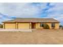 Inviting home with a spacious three car garage and well-maintained front yard at 1600 W Ivar Rd, San Tan Valley, AZ 85144