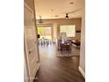 Bright living room with neutral walls, herringbone floors, and sliding doors to the backyard at 20865 E Shetland St, Queen Creek, AZ 85142