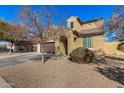 Charming two-story home featuring a tile roof, desert landscaping, and an arched entryway at 2324 W Melody Dr, Phoenix, AZ 85041