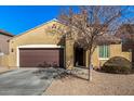 Single story home with low maintenance desert landscaping leading to a covered front entrance at 2324 W Melody Dr, Phoenix, AZ 85041