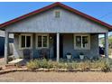 Charming front porch with garden bed and relaxing seating provides curb appeal at 2618 N 15Th St, Phoenix, AZ 85006