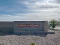 Estrella Crossing community sign with a professionally landscaped entrance, providing a welcoming feel at 5515 W Hopi Trl, Laveen, AZ 85339