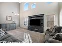 Spacious living room featuring high ceilings, modern furniture, and plenty of natural light at 11451 E Starkey Ave, Mesa, AZ 85212