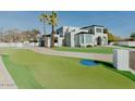 Beautiful home featuring an amazing backyard with a green putting range at 11745 N 99Th St, Scottsdale, AZ 85260