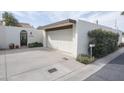 Detached two-car garage with driveway and mature landscaping for privacy at 1221 E Palacio Dr, Phoenix, AZ 85014