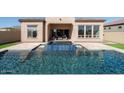 Backyard pool and patio featuring outdoor seating at 12245 E Clinton St, Scottsdale, AZ 85259