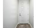 Modern entryway featuring a white front door with decorative glass insets and neutral wall color at 1717 E Morten Ave # 16, Phoenix, AZ 85020