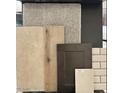 A flat lay sample of carpet, flooring, backsplash and paint colors for a home at 17566 W Georgia Ave, Litchfield Park, AZ 85340