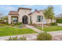 Charming two-story home with a well-manicured lawn and inviting curb appeal at 20618 W Western Dr, Buckeye, AZ 85396