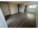 Large living room area with a view into the kitchen with stainless steel appliances at 2625 E Indian School Rd # 335, Phoenix, AZ 85016